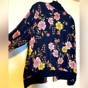 Torrid light weight floral jacket. Short but not cropped.